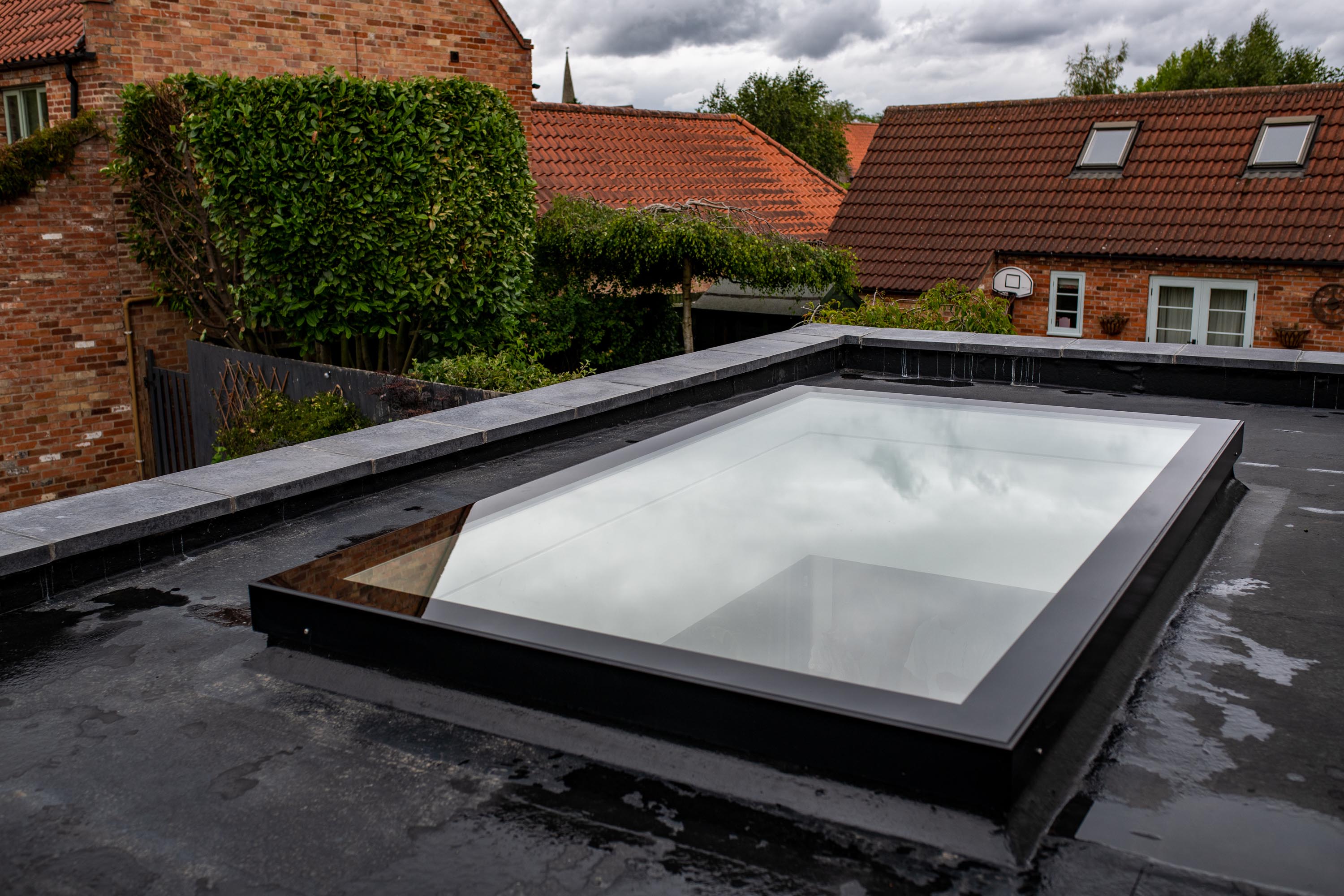exterior close up image of a bespoke rooflight, rooflight is very clean and installed on a flat roof 