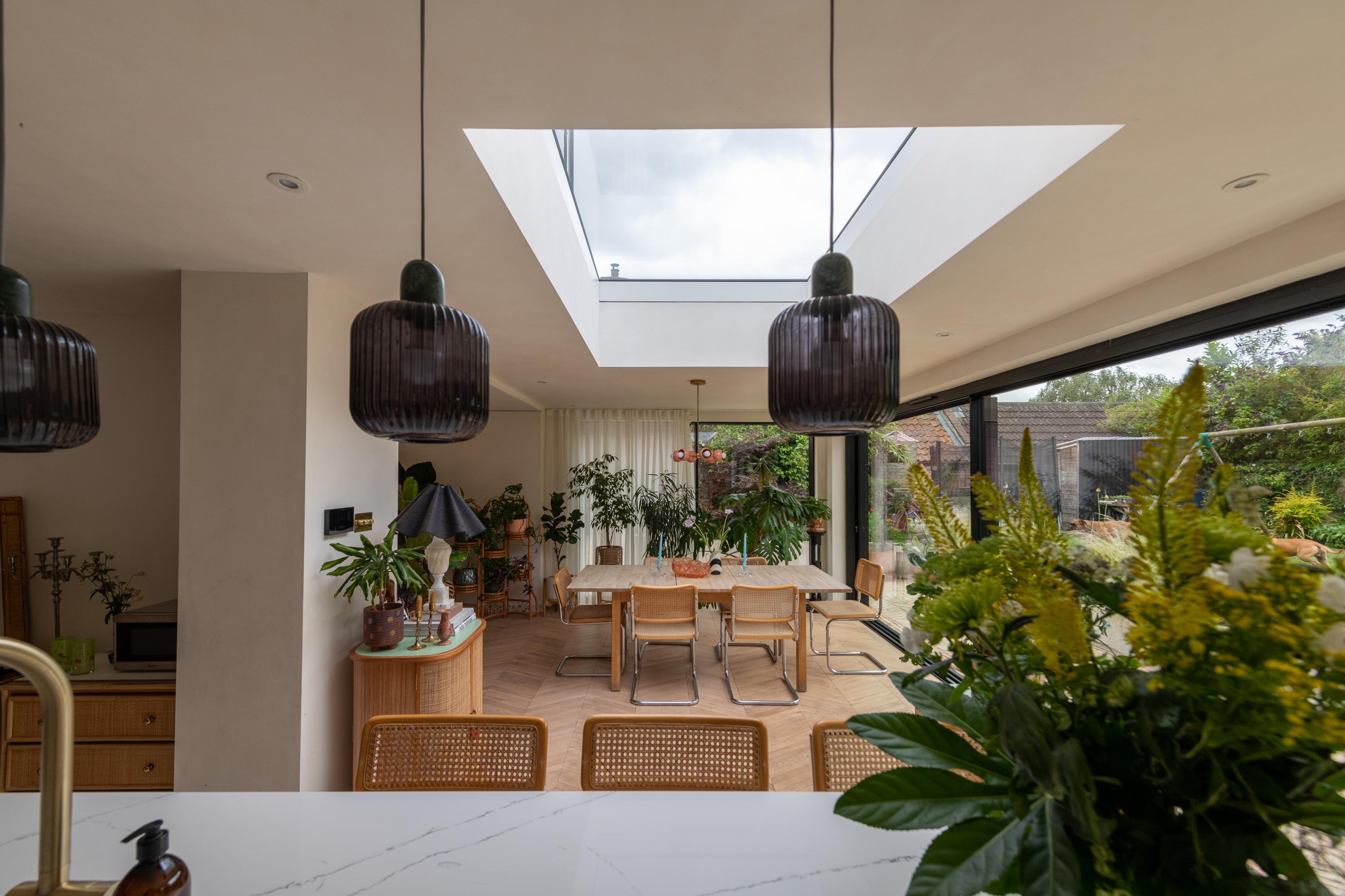 Bespoke roof light above a kitchen dining extension. Image taken from kitchen island angled towards the skylight - room is filled with natural light