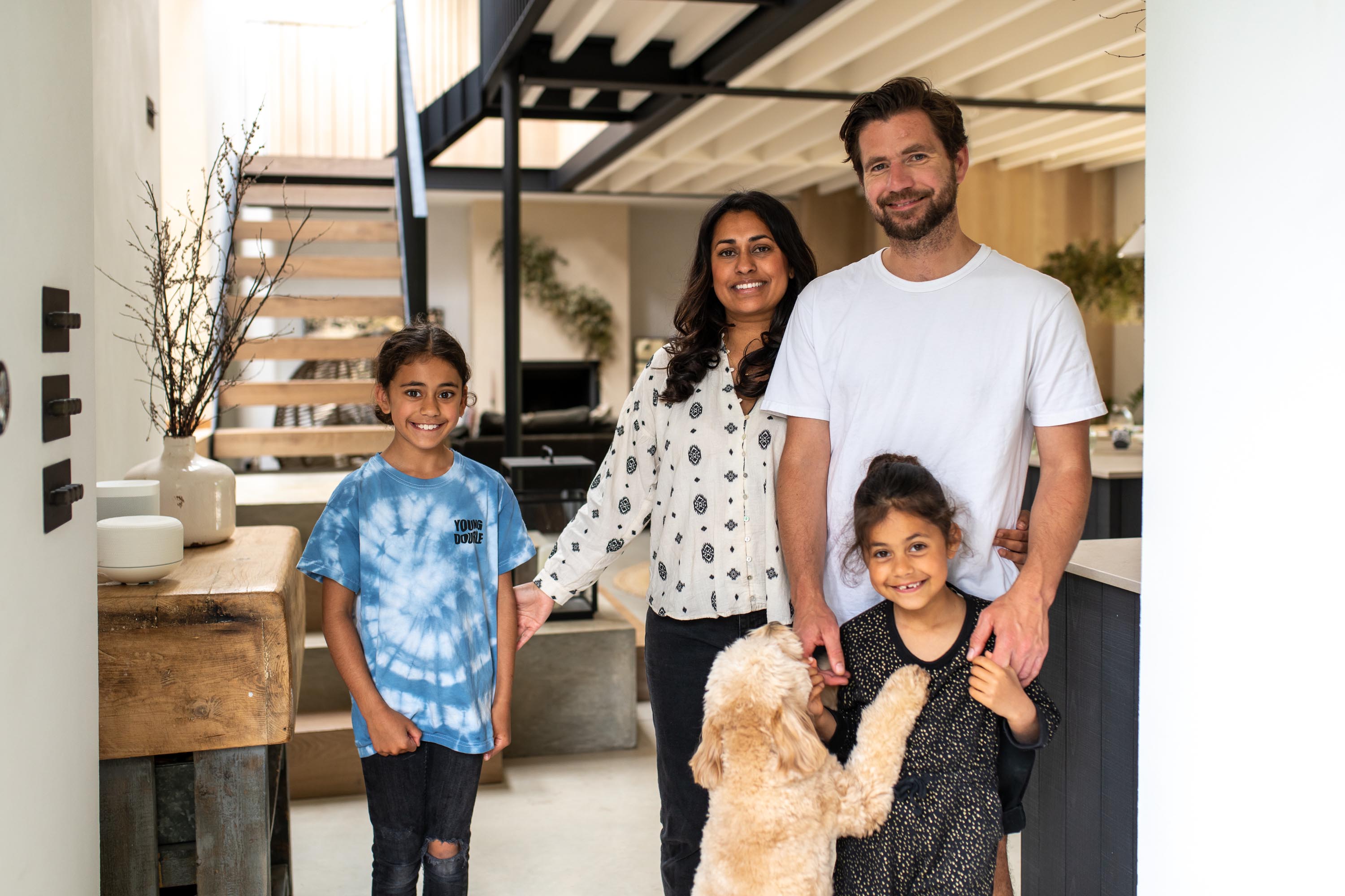 family of four with pet dog